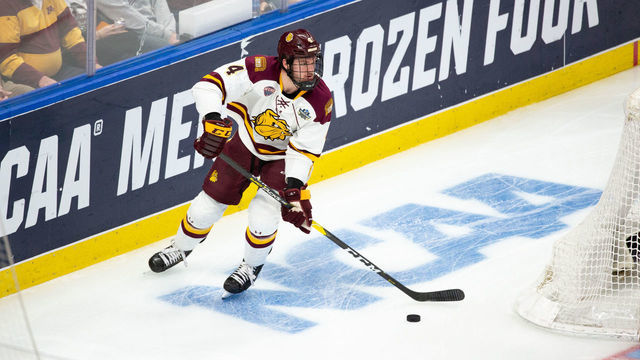 BUFFALO, NY - APRIL 13: Dylan Samberg #4 of the Minnesota Duluth Bulldogs skates against the Massachusetts Minutemen during the 2019 NCAA Division I Men's Hockey Frozen Four Championship final at the KeyBank Center on April 13, 2019 in Buffalo, New York. The Bulldogs won the game 3-0 and captured their second consecutive NCAA national championship.