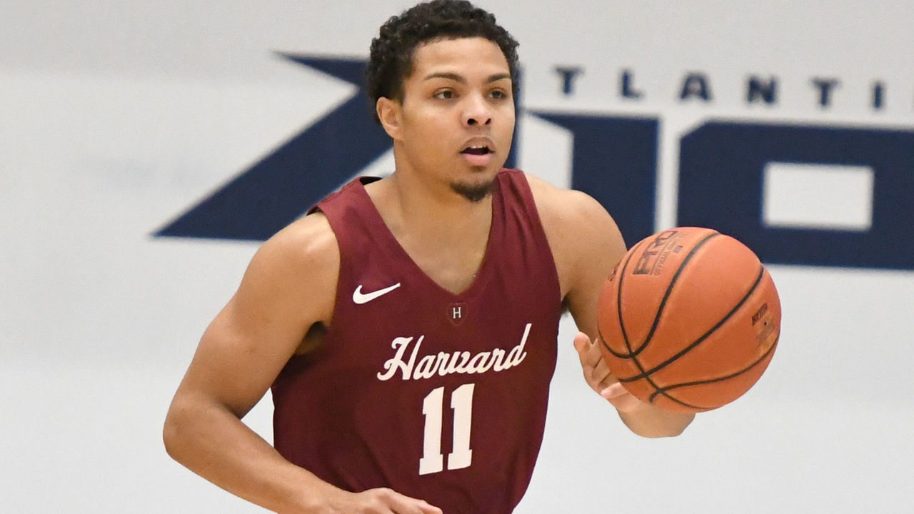WASHINGTON, DC - DECEMBER 21: Bryce Aiken #11 of the Harvard Crimson dribbles up court during a college basketball game against the George Washington Colonials at the Smith Center on December 21, 2019 in Washington, DC.