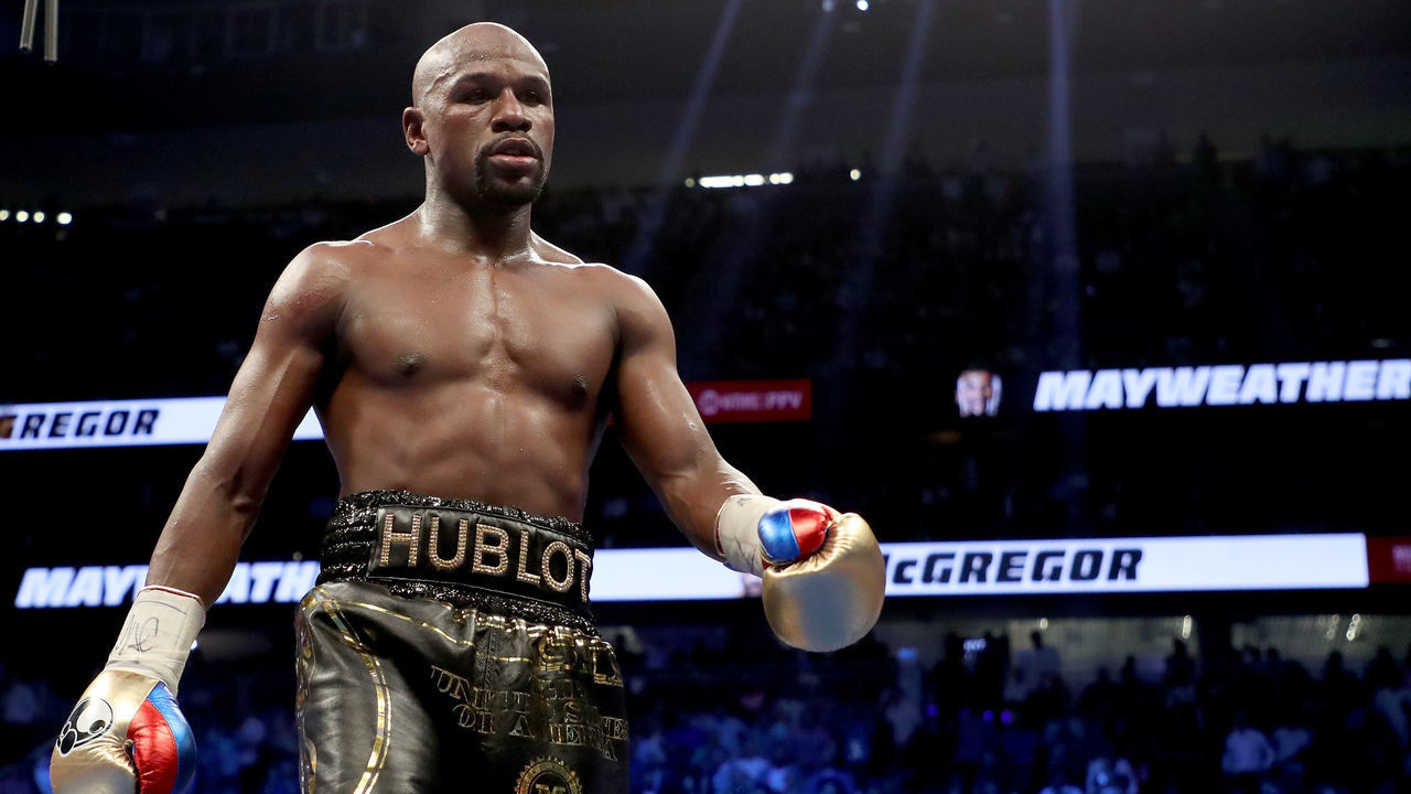 LAS VEGAS, NV - AUGUST 26: Floyd Mayweather Jr. walks to his corner while taking on Conor McGregor during their super welterweight boxing match on August 26, 2017 at T-Mobile Arena in Las Vegas, Nevada.
