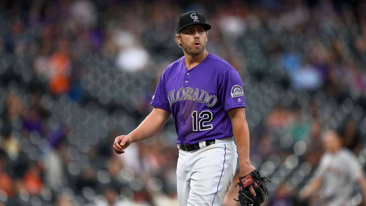 DENVER, CO - JULY 15: Mark Reynolds #12 of the Colorado Rockies walks off the field after pitching in relief in the ninth inning of a game against the San Francisco Giants during game one of a doubleheader at Coors Field on July 15, 2019 in Denver, Colorado.