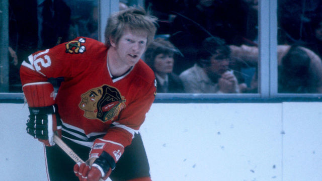 UNIONDALE, NY - 1973: Pat Stapleton #12 of the Chicago Blackhawks skates on the ice with the puck during an NHL game against the New York Islanders circa 1973 at the Nassau Coliseum in Uniondale, New York.