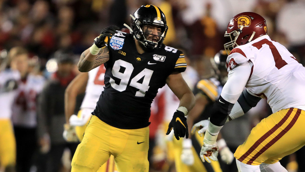 SAN DIEGO, CALIFORNIA - DECEMBER 27: Austin Jackson #73 of the USC Trojans blocks A.J. Epenesa #94 of the Iowa Hawkeyes during the second half of the San Diego County Credit Union Holiday Bowl at SDCCU Stadium on December 27, 2019 in San Diego, California.