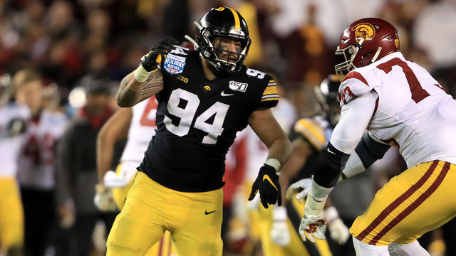 SAN DIEGO, CALIFORNIA - DECEMBER 27: Austin Jackson #73 of the USC Trojans blocks A.J. Epenesa #94 of the Iowa Hawkeyes during the second half of the San Diego County Credit Union Holiday Bowl at SDCCU Stadium on December 27, 2019 in San Diego, California.