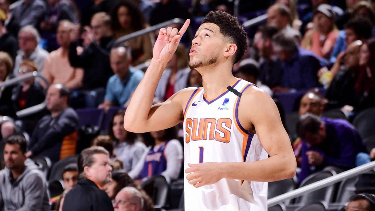 PHOENIX, AZ - FEBRUARY 12: Devin Booker #1 of the Phoenix Suns takes the floor for the game against the Golden State Warriors on February 12, 2020 at Talking Stick Resort Arena in Phoenix, Arizona. Mandatory Copyright Notice: Copyright 2020 NBAE