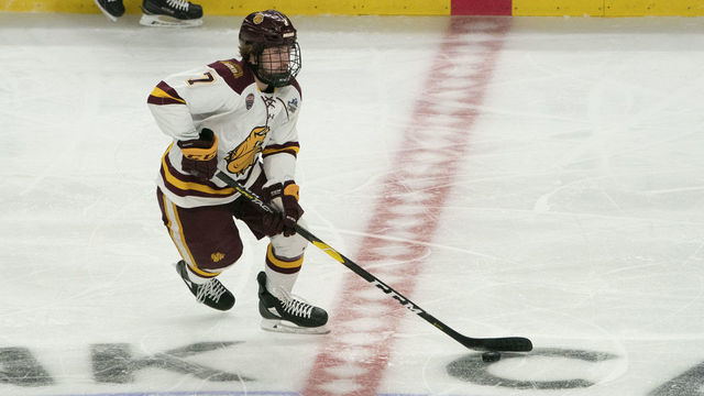BUFFALO, NY - APRIL 13: Minnesota Duluth Bulldogs Defenseman Scott Perunovich (7) skates with the puck during the first period of the NCAA Hockey Frozen Four championship game between the Massachusetts Minutemen and the Minnesota Duluth Bulldogs on April 13, 2019, at KeyBank Center in Buffalo, NY.