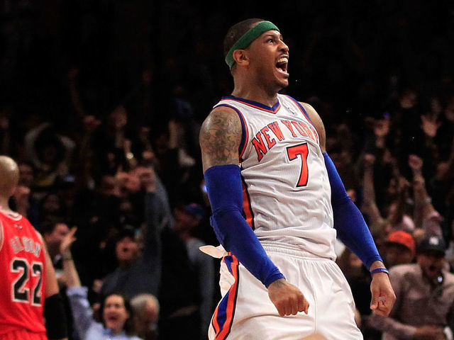 NEW YORK, NY - APRIL 08: Carmelo Anthony #7 of the New York Knicks shoots the game game tying three pointer in the fourth quarter as Taj Gibson #22 of the Chicago Bulls looks on at Madison Square Garden on April 8, 2012 in New York City. NOTE TO USER: User expressly acknowledges and agrees that, by downloading and/or using this Photograph, user is consenting to the terms and conditions of the Getty Images License Agreement.