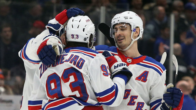 NEW YORK, NEW YORK - FEBRUARY 25: Mika Zibanejad #93 and Chris Kreider #20 of the New York Rangers celebrate their 4-3 overtime victory over the New York Islanders at NYCB Live's Nassau Coliseum on February 25, 2020 in Uniondale, New York.
