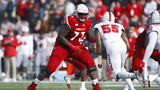 LOUISVILLE, KY - NOVEMBER 17: Mekhi Becton #73 of the Louisville Cardinals blocks against the North Carolina State Wolfpack during the game at Cardinal Stadium on November 17, 2018 in Louisville, Kentucky.