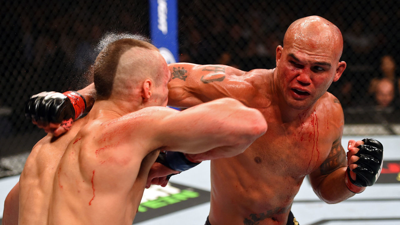 LAS VEGAS, NV - JULY 11: (R-L) punches Rory MacDonald in their UFC welterweight title fight during the UFC 189 event inside MGM Grand Garden Arena on July 11, 2015 in Las Vegas, Nevada.