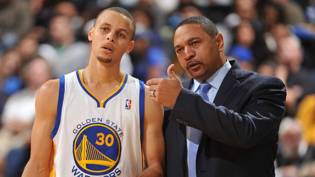 OAKLAND, CA - JANUARY 10: Head Coach Mark Jackson of the Golden State Warriors coaches player Stephen Curry #30 against the Boston Celtics on January 10, 2014 at Oracle Arena in Oakland, California. NOTE TO USER: User expressly acknowledges and agrees that, by downloading and or using this photograph, user is consenting to the terms and conditions of Getty Images License Agreement. Mandatory Copyright Notice: Copyright 2014 NBAE