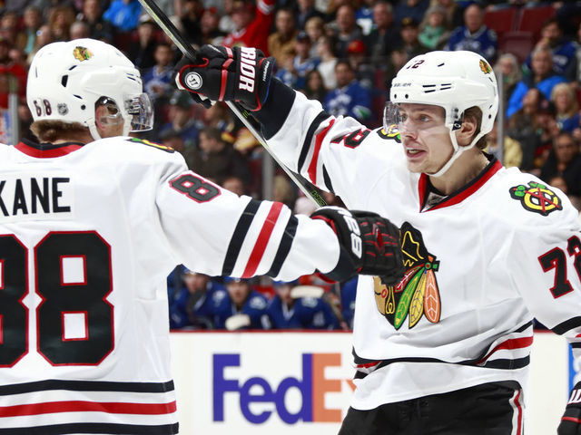 VANCOUVER, BC - NOVEMBER 19: Artemi Panarin #72 of the Chicago Blackhawks is congratulated by teammate Patrick Kane #88 after scoring during their NHL game against the Vancouver Canucks at Rogers Arena November 19, 2016 in Vancouver, British Columbia, Canada.