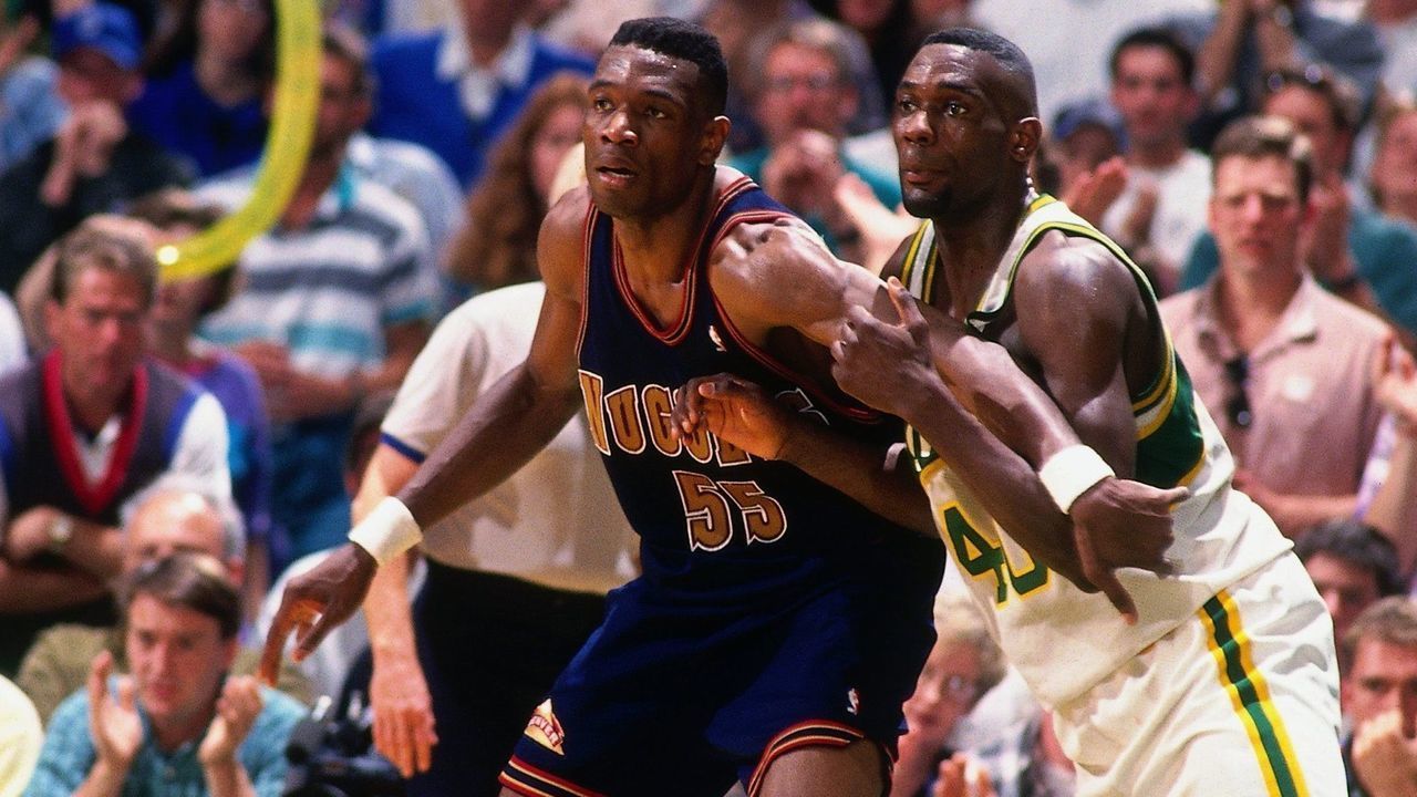 SEATTLE - MAY 7: Dikembe Mutombo #55 of the Denver Nuggets posts up against Shawn Kemp #40 of the Seattle Supersonics during Game Five of the Western Conference Quarterfinals played on May 7, 1994 at the Seattle Center Coliseum in Seattle, Washington. The Nuggets defeated the Supersonics 98-94 and won the series 3-2. NOTE TO USER: User expressly acknowledges that, by downloading and or using this photograph, User is consenting to the terms and conditions of the Getty Images License agreement. Mandatory Copyright Notice: Copyright 1994 NBAE