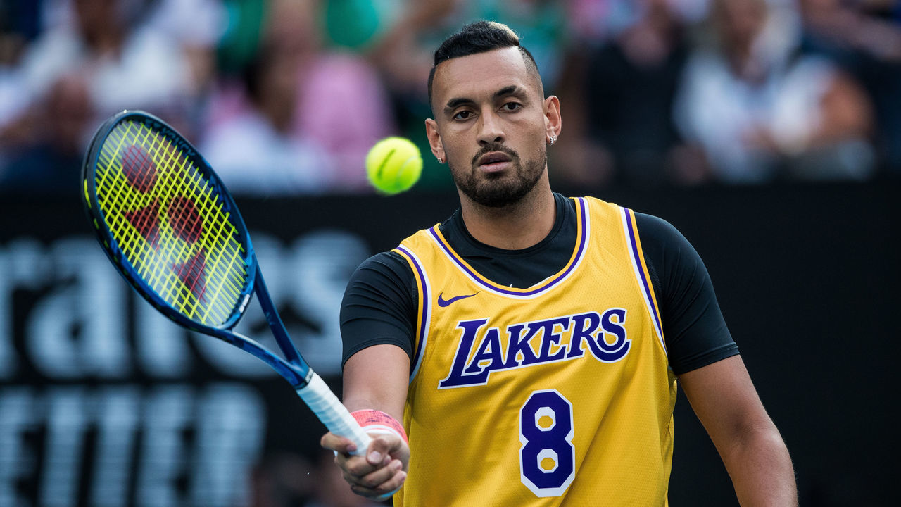 MELBOURNE, AUSTRALIA - JANUARY 27: Nick Kyrgios of Australia pays respect to NBA legend Kobe Bryant in his fourth round match against Rafael Nadal of Spain on day nine of the 2020 Australian Open at Melbourne Park on January 27, 2020 in Melbourne, Australia.