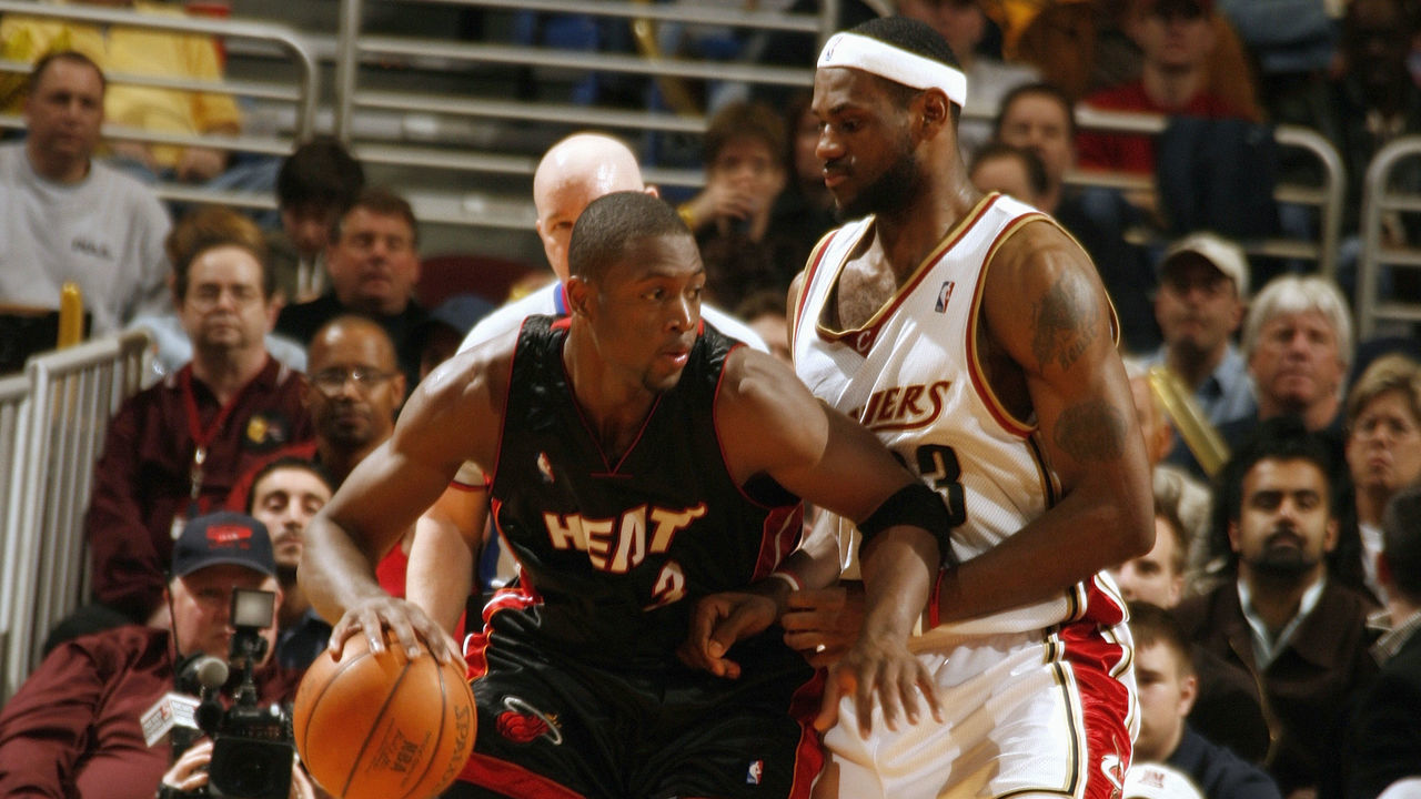CLEVELAND - APRIL 1: Dwyane Wade #3 of the Miami Heat dribbles against LeBron James #23 of the Cleveland Cavaliers at Quicken Loans Arena on April 1, 2006 in Cleveland, Ohio. The Cavaliers won 106-99. NOTE TO USER: User expressly acknowledges and agrees that, by downloading and/or using this Photograph, user is consenting to the terms and conditions of the Getty Images License Agreement. Mandatory Copyright Notice: Copyright 2006 NBAE