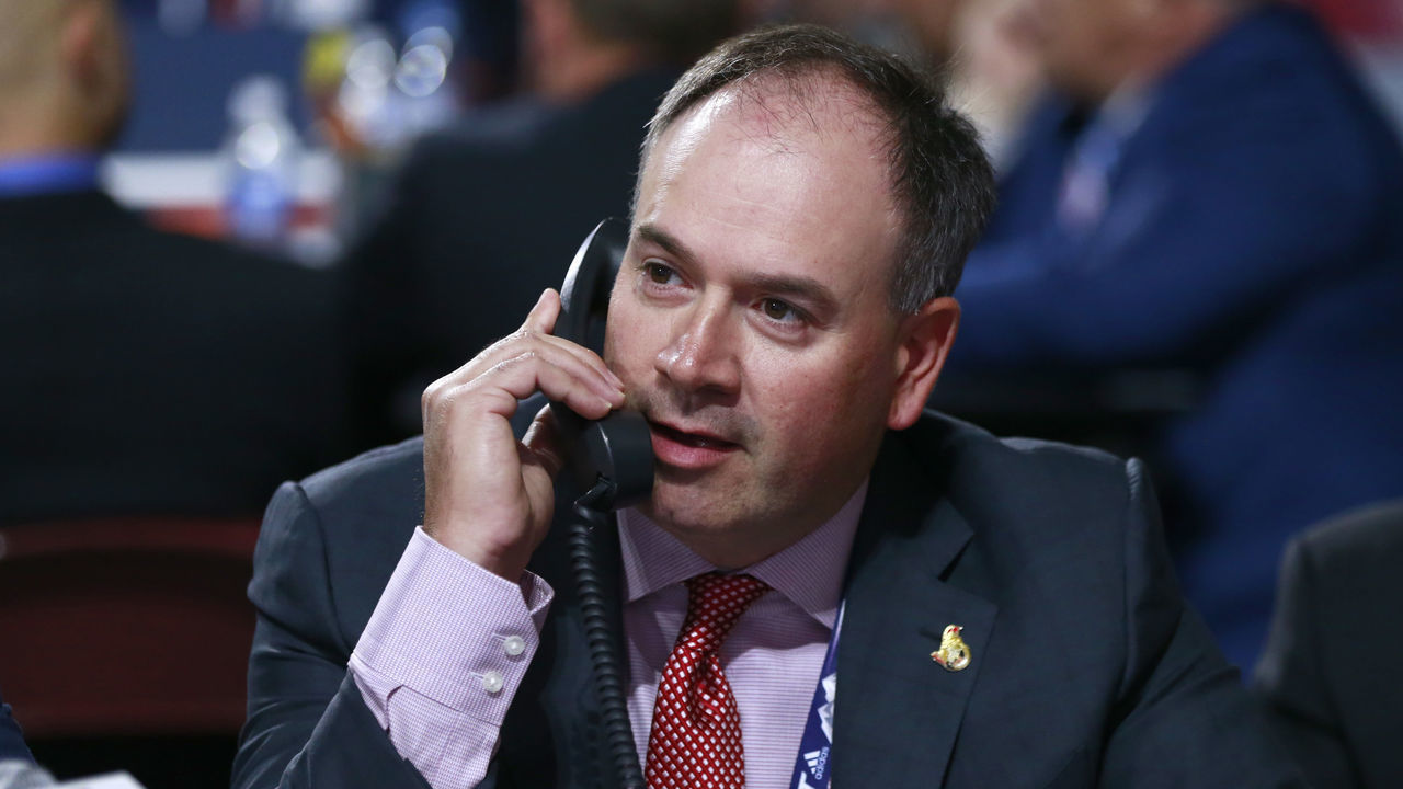 VANCOUVER, BRITISH COLUMBIA - JUNE 22: General manager Pierre Dorion of the Ottawa Senators talks on the phone on the draft floor during Rounds 2-7 of the 2019 NHL Draft at Rogers Arena on June 22, 2019 in Vancouver, Canada.
