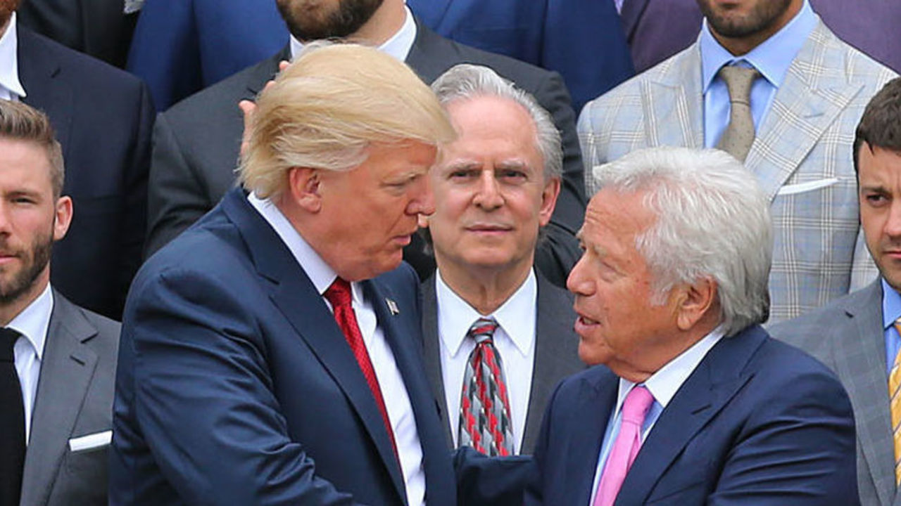 WASHINGTON D.C. - APRIL 19: President Donald Trump, center left, shakes hands with New England Patriots team owner Robert Kraft, center right, as the team stands behind them during a ceremony at the White House in Washington D.C. on Apr. 19, 2017.