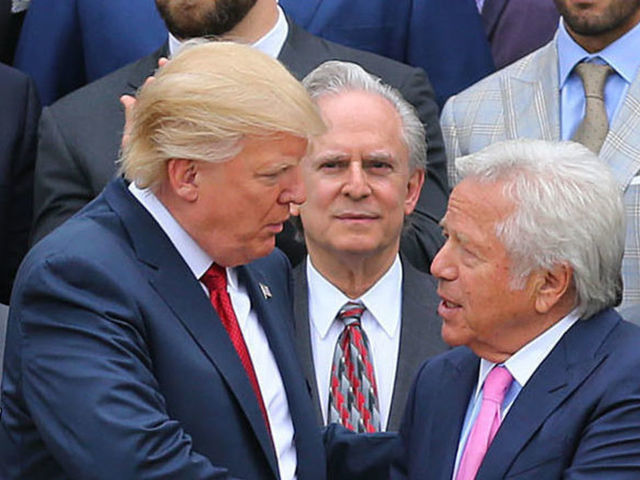 WASHINGTON D.C. - APRIL 19: President Donald Trump, center left, shakes hands with New England Patriots team owner Robert Kraft, center right, as the team stands behind them during a ceremony at the White House in Washington D.C. on Apr. 19, 2017.