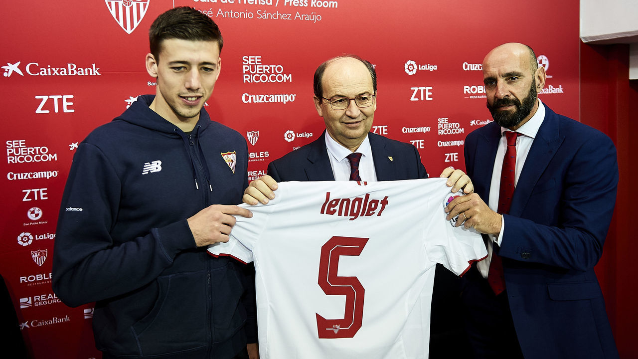 SEVILLE, SPAIN - JANUARY 09: (L-R) Clement Lenglet of Sevilla FC, president of Sevilla FC Jose Castro and sport director of Sevilla FC Ramon Rodriguez "Monchi" attends the press conference during his official presentation at the Estadio Ramon Sanchez Pizjuan on January 9, 2017 in Seville, Spain.