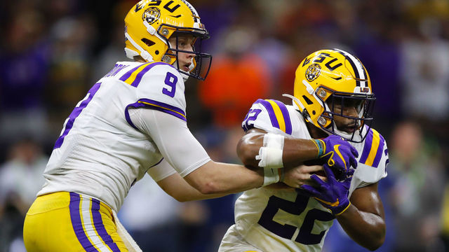 NEW ORLEANS, LA - JANUARY 13: LSU Tigers quarterback Joe Burrow (9) hands off to running back Clyde Edwards-Helaire (22) during the second half of the College Football Playoff National Championship Game between the LSU Tigers and the Clemson Tigers on January 13, 2020 in New Orleans LA.