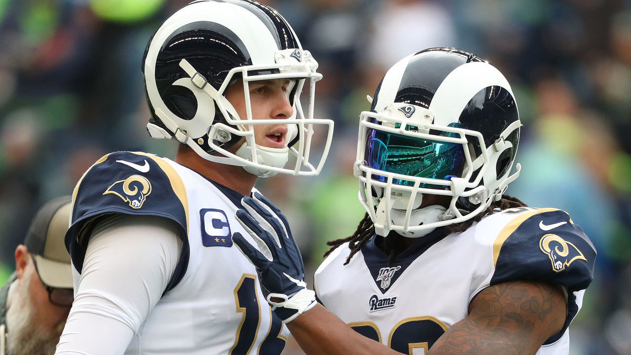 SEATTLE, WASHINGTON - OCTOBER 03: Jared Goff #16 and Todd Gurley #30 of the Los Angeles Rams have a conversation prior to taking on the Seattle Seahawks during their game at CenturyLink Field on October 03, 2019 in Seattle, Washington.