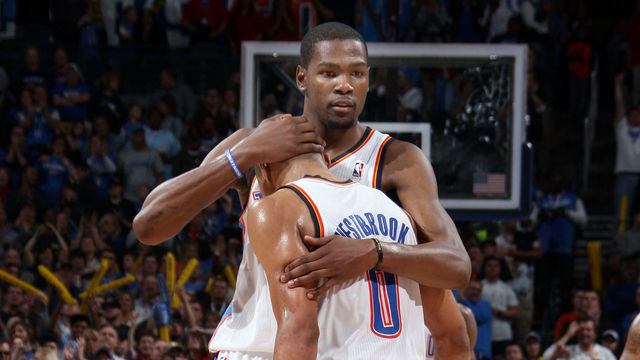 OKLAHOMA CITY, OK - FEBRUARY 19: Kevin Durant #35 of the Oklahoma City Thunder gives a congratulatory hug to Russell Westbrook #0 of the Oklahoma City Thunder during the game between the Oklahoma City Thunder and the Denver Nuggets on February 19, 2012 at the Chesapeake Energy Arena in Oklahoma City, Oklahoma. Mandatory Copyright Notice: Copyright 2012 NBAE