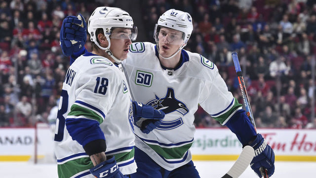 MONTREAL, QC - FEBRUARY 25: Jake Virtanen #18 of the Vancouver Canucks celebrates his goal with teammate Tyler Myers #57 during the third period against the Montreal Canadiens at the Bell Centre on February 25, 2020 in Montreal, Canada. The Vancouver Canucks defeated the Montreal Canadiens 4-3 in overtime.