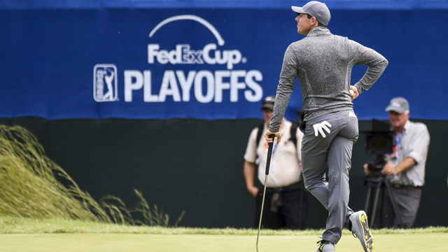 NORTON, MA - SEPTEMBER 05: Rory McIlroy of Northern Ireland stands near the FedExCup Playoffs logo on the 16th hole green during the final round of the Deutsche Bank Championship at TPC Boston on September 5, 2016 in Norton, Massachusetts.