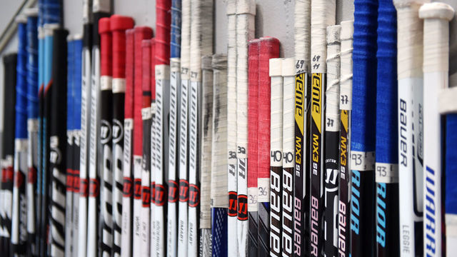 Hockey sticks are lined up along a wall at the DEL ice hockey title round quarter finals match between EHC Muenchen and Straubing Tigers in the Olympia Eishalle in Munich, Germany, 24 March 2016. The game ended 2-1. Photo: TOBIAS HASE/dpa | usage worldwide