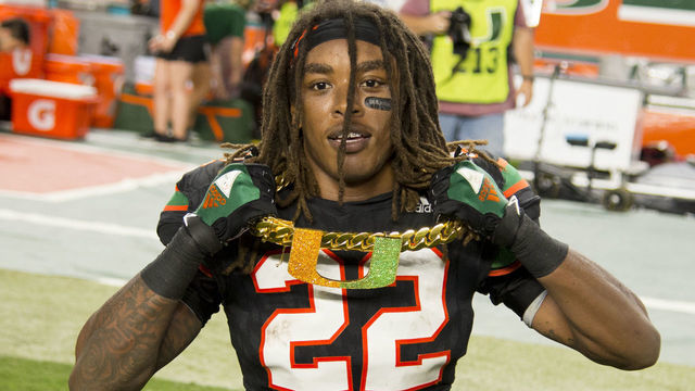 MIAMI GARDENS, FL - NOVEMBER 04: University of Miami Hurricanes Defensive Back Sheldrick Redwine (22) celebrates with the UM "Turnover Chain" after intercepting a pass from Virginia Tech Hokies Quarterback Josh Jackson (not shown)during the college football game between the Virginia Tech Hokies and the University of Miami Hurricanes on November 4, 2017 at the Hard Rock Stadium in Miami Gardens, FL.