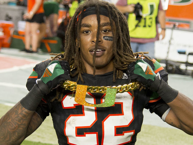 MIAMI GARDENS, FL - NOVEMBER 04: University of Miami Hurricanes Defensive Back Sheldrick Redwine (22) celebrates with the UM "Turnover Chain" after intercepting a pass from Virginia Tech Hokies Quarterback Josh Jackson (not shown)during the college football game between the Virginia Tech Hokies and the University of Miami Hurricanes on November 4, 2017 at the Hard Rock Stadium in Miami Gardens, FL.