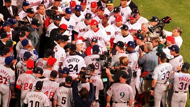 BOSTON - JULY 13: Players greet former Boston Red Sox left fielder Ted Williams before the start of the 1999 All-Star Game at Fenway Park in Boston on July 13, 1999. (Max Becherer for The Boston Globe via Getty Images)