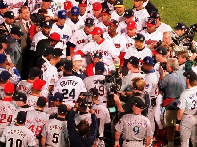 BOSTON - JULY 13: Players greet former Boston Red Sox left fielder Ted Williams before the start of the 1999 All-Star Game at Fenway Park in Boston on July 13, 1999. (Max Becherer for The Boston Globe via Getty Images)