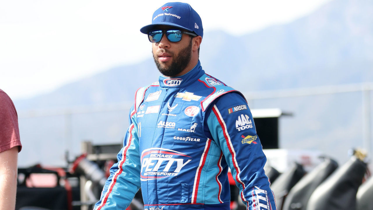 FONTANA, CALIFORNIA - FEBRUARY 28: Bubba Wallace, driver of the #43 Victory Junction Chevrolet, walks through the garage area during practice for the NASCAR Cup Series Auto Club 400 at Auto Club Speedway on February 28, 2020 in Fontana, California.