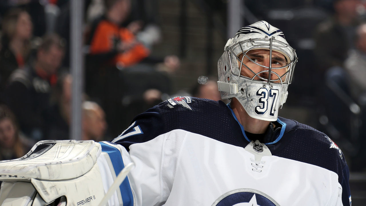 PHILADELPHIA, PA - FEBRUARY 22: Connor Hellebuyck #37 of the Winnipeg Jets looks on during a stoppage in play against the Philadelphia Flyers on February 22, 2020 at the Wells Fargo Center in Philadelphia, Pennsylvania.