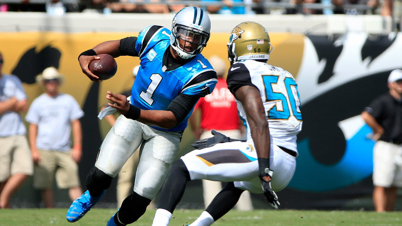 JACKSONVILLE, FL - SEPTEMBER 13: Cam Newton #1 of the Carolina Panthers is defended by Telvin Smith #50 of the Jacksonville Jaguars during the game at EverBank Field on September 13, 2015 in Jacksonville, Florida.