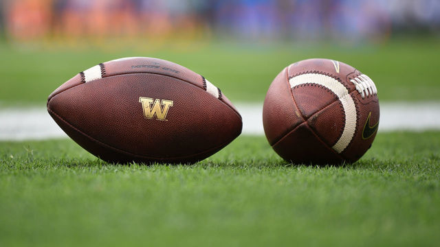 PASADENA, CA - OCTOBER 06: Two footballs with the Washington Huskies' logo on them during a college football game between the Washington Huskies and the UCLA Bruins on October 6, 2018 at the Rose Bowl in Pasadena, CA.
