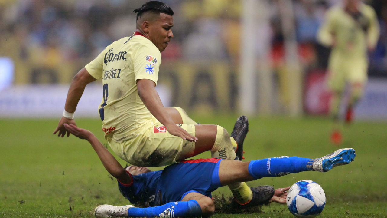 MEXICO CITY, MEXICO - AUGUST 11: Roger Martinez of America fights for the ball with Eric Cantu of Monterrey during the fourth round match between Club America and Monterrey as part of the Torneo Apertura 2018 Liga MX at Azteca Stadium on August 11, 2018 in Mexico City, Mexico.