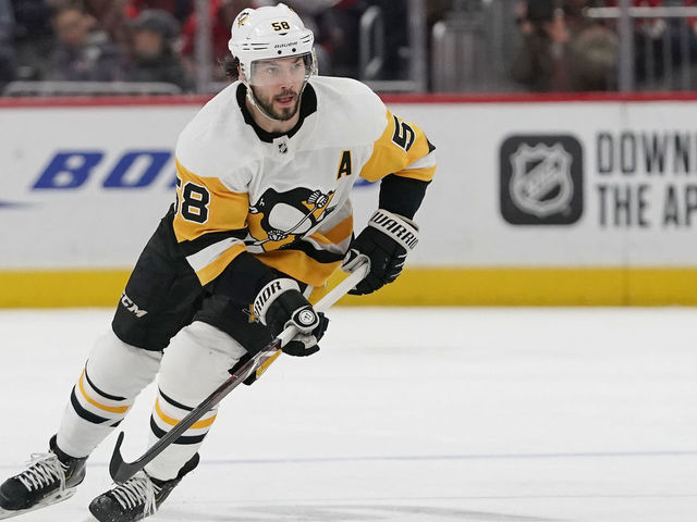 WASHINGTON, DC - FEBRUARY 23: Kris Letang #58 of the Pittsburgh Penguins skates with the puck against the Washington Capitals in the second period at Capital One Arena on February 23, 2020 in Washington, DC.