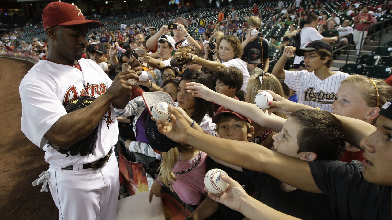 HOUSTON,TX- JULY 20: Center fielder Michael Bourn #21 of the Houston Astros signs autographs before the Astros played against the Washington Nationals on July 20, 2011 at Minute Maid Park in Houston, Texas. Astros won in the bottom of the 11th 3 to 2.