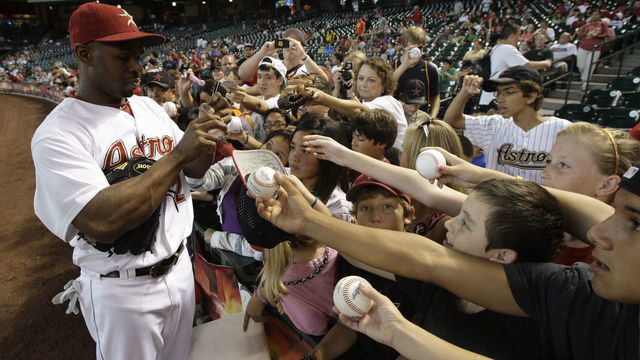 HOUSTON,TX- JULY 20: Center fielder Michael Bourn #21 of the Houston Astros signs autographs before the Astros played against the Washington Nationals on July 20, 2011 at Minute Maid Park in Houston, Texas. Astros won in the bottom of the 11th 3 to 2.