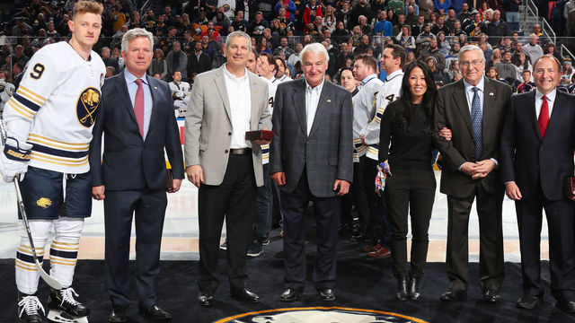 BUFFALO, NY - FEBRUARY 13: Jack Eichel #9 of the Buffalo Sabres and Nick Foligno #71 of the Columbus Blue Jackets pose with former Buffalo Sabres ownership from the 2000 era prior to an NHL game on February 13, 2020 at KeyBank Center in Buffalo, New York. Pictured with them left to right are Larry Quinn, Dan DiPofi, B. Thomas Golisano, current owners Kim and Terry Pegula, and NHL Commissioner Gary Bettman.