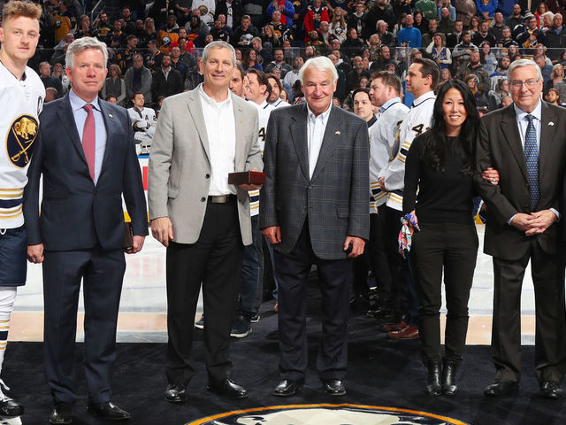 BUFFALO, NY - FEBRUARY 13: Jack Eichel #9 of the Buffalo Sabres and Nick Foligno #71 of the Columbus Blue Jackets pose with former Buffalo Sabres ownership from the 2000 era prior to an NHL game on February 13, 2020 at KeyBank Center in Buffalo, New York. Pictured with them left to right are Larry Quinn, Dan DiPofi, B. Thomas Golisano, current owners Kim and Terry Pegula, and NHL Commissioner Gary Bettman.