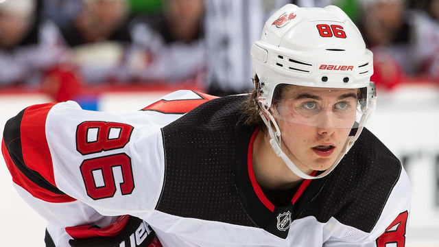 DETROIT, MI - FEBRUARY 25: Jack Hughes #86 of the New Jersey Devils gets set for the face-off against the Detroit Red Wings during an NHL game at Little Caesars Arena on February 25, 2020 in Detroit, Michigan. The Devils defeated the Wings 4-1.