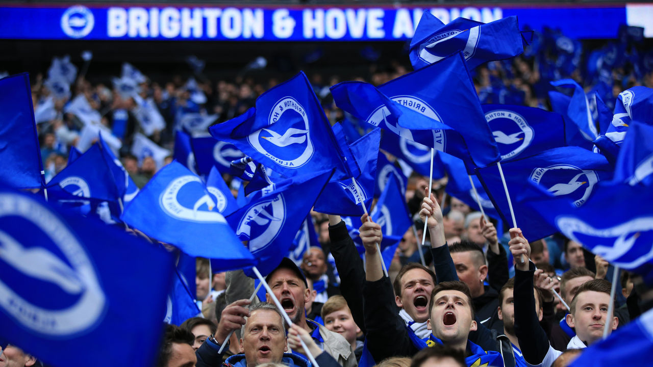 LONDON, ENGLAND - APRIL 06: Brighton fans wave flags during the FA Cup Semi Final match between Manchester City and Brighton and Hove Albion at Wembley Stadium on April 6, 2019 in London, England.