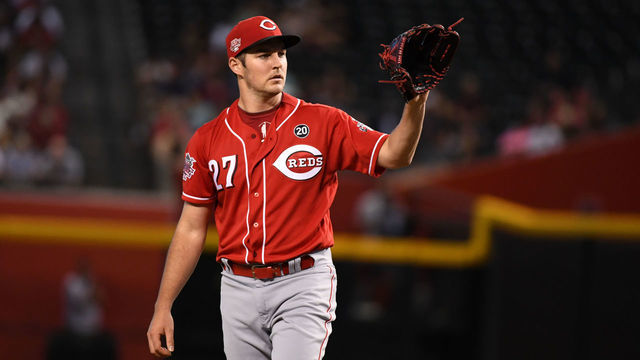 PHOENIX, ARIZONA - SEPTEMBER 15: Trevor Bauer #27 of the Cincinnati Reds catches a throw back from home plate during a game against the Arizona Diamondbacks at Chase Field on September 15, 2019 in Phoenix, Arizona.