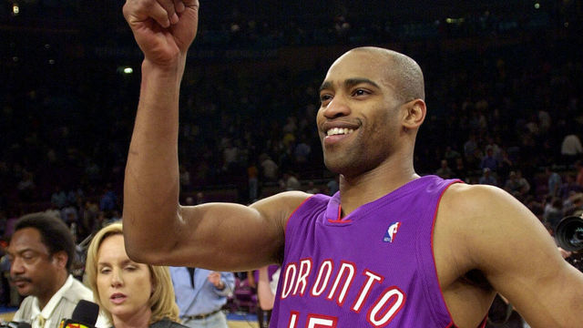Vince Carter of the Toronto Raptors celebrates his team's 93-89 win over the New York Knicks 04 May 2001 at Madison Square Garden in New York. The Raptors won the series 3-2 and advance to the second round of the NBA Eastern Conference playoffs. Carter scored 27 points to lead the Raptors. AFP PHOTO/Stan HONDA