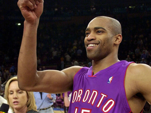 Vince Carter of the Toronto Raptors celebrates his team's 93-89 win over the New York Knicks 04 May 2001 at Madison Square Garden in New York. The Raptors won the series 3-2 and advance to the second round of the NBA Eastern Conference playoffs. Carter scored 27 points to lead the Raptors. AFP PHOTO/Stan HONDA