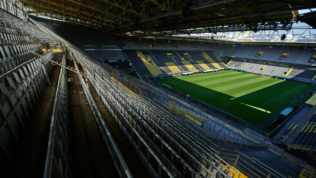 dpatop - 21 April 2020, North Rhine-Westphalia, Dortmund: The view from the south stand of the Signal Iduna Park, stadium of Borussia Dortmund, onto the playing field. Politicians are discussing a possible resumption of the Bundesliga with ghost games. Photo: Bernd Thissen/dpa - IMPORTANT NOTE: In accordance with the regulations of the DFL Deutsche Fußball Liga and the DFB Deutscher Fußball-Bund, it is prohibited to exploit or have exploited in the stadium and/or from the game taken photographs in the form of sequence images and/or video-like photo series.