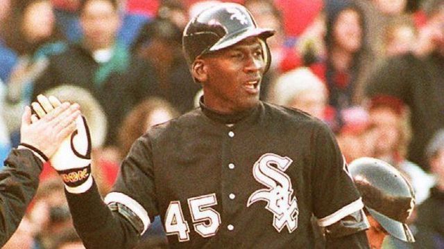 CHICAGO, IL - APRIL 7: Chicago White Sox outfielder Michael Jordan (R) is greeted by a unidentified batboy at Chicago's Wrigley Field, 07 April 1994, after scoring on a sixth inning home run during a crosstown exhibition game against the Cubs. Jordan, who will return to the minor leagues after the game, had two hits as the teams tied 4-4.