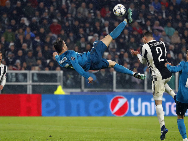TURIN, ITALY - APRIL 03: Cristiano Ronaldo of Real Madrid scores his team's second goal during the UEFA Champions League Quarter Final Leg One match between Juventus and Real Madrid at Juventus Stadium on April 3, 2018 in Turin, Italy.